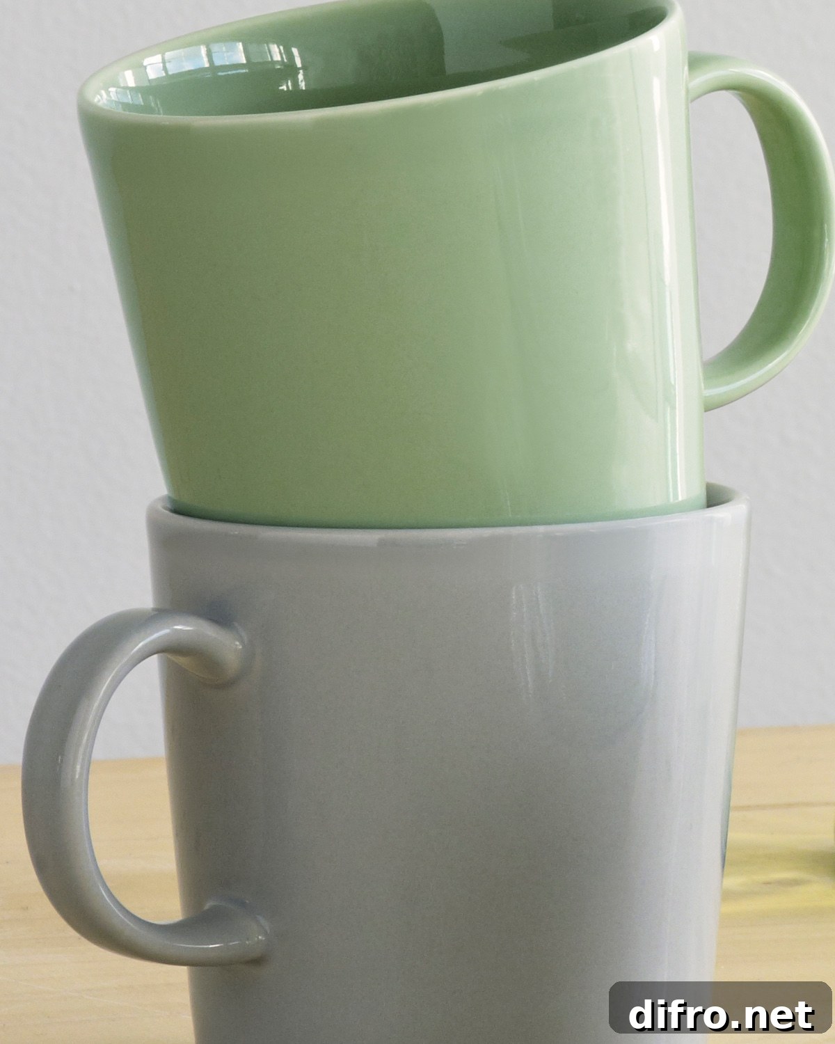 Teema mugs in pearl grey and celadon green.