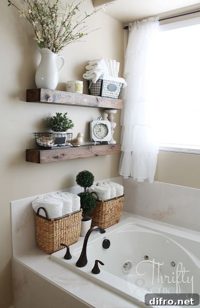 Floating Shelf Ideas to Style Your Living Room 14 Chic bathroom with floating shelves that hold a clock, towels, and a metal wire basket.