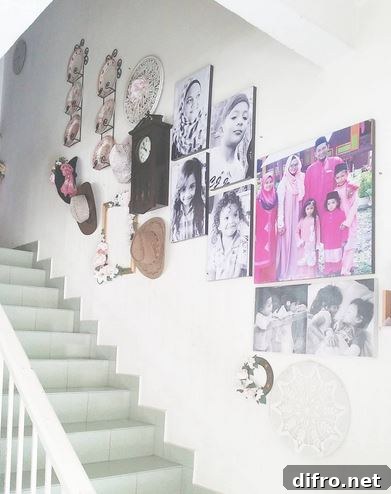 Stairway gallery that hosts an array of family pictures and hats.