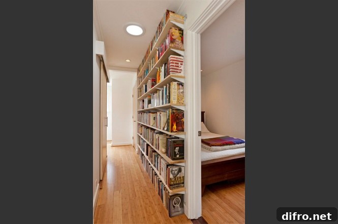 Hallway with tall bookshelves visible near a bedroom entrance.