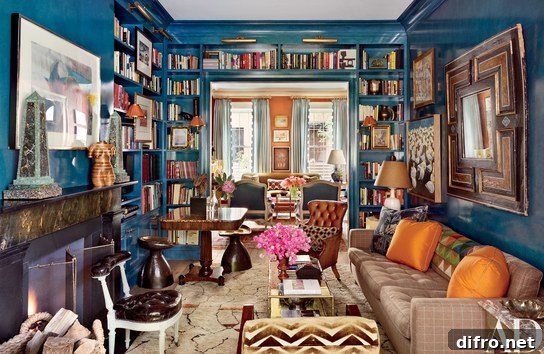 A living room with vibrant blue walls and elegant shelves above the doorway.