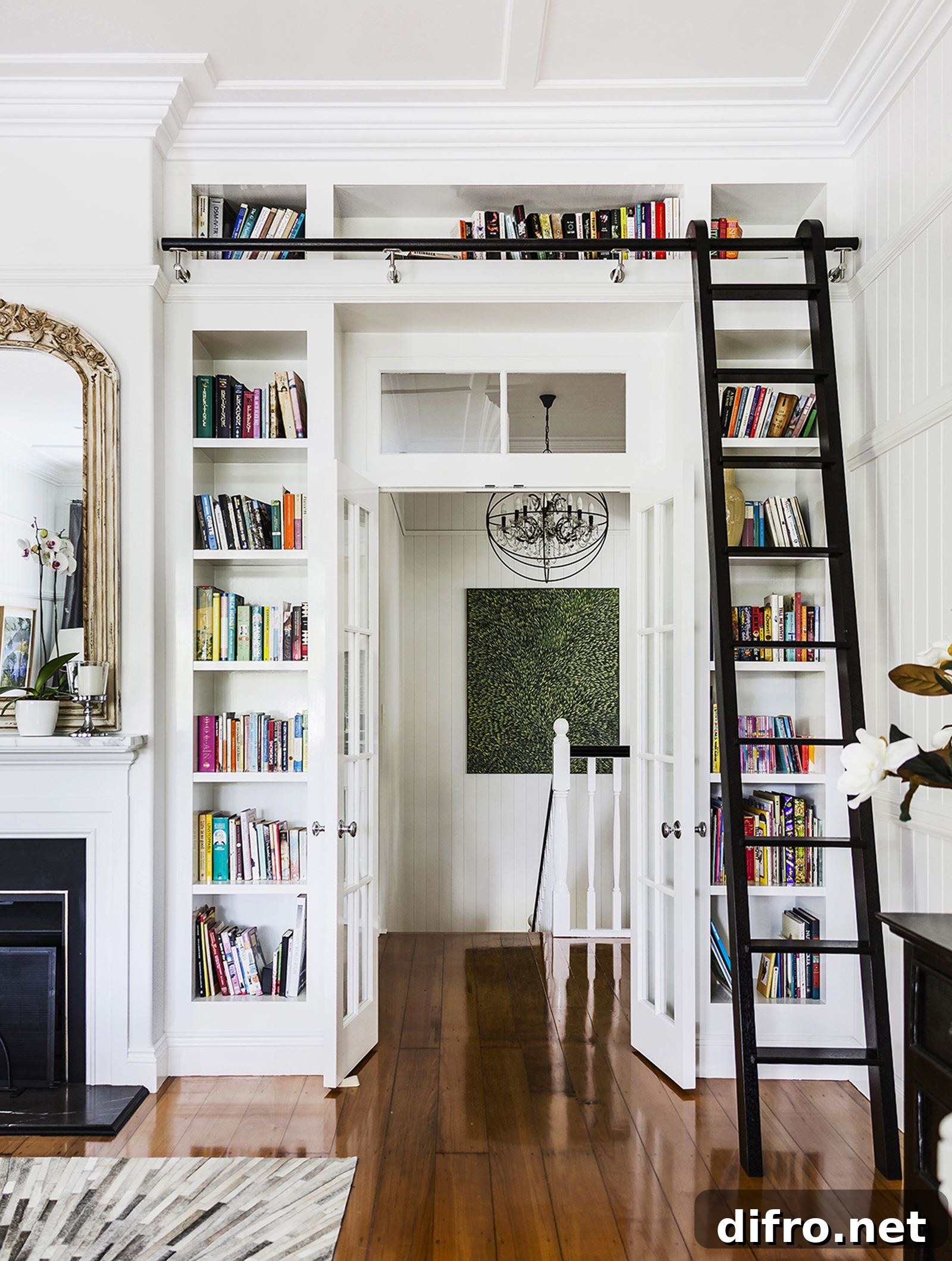 White-themed room with a ladder accessing an above-door bookcase.