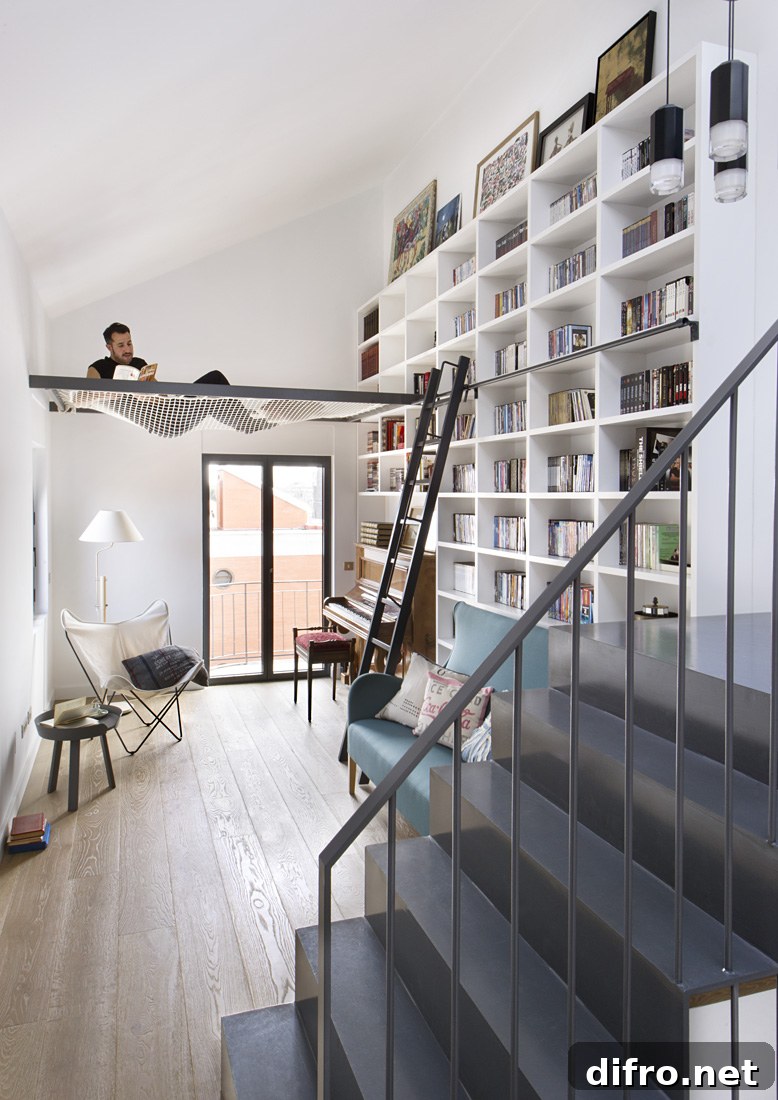 Person reading in a hammock inside a room with a large bookshelf.