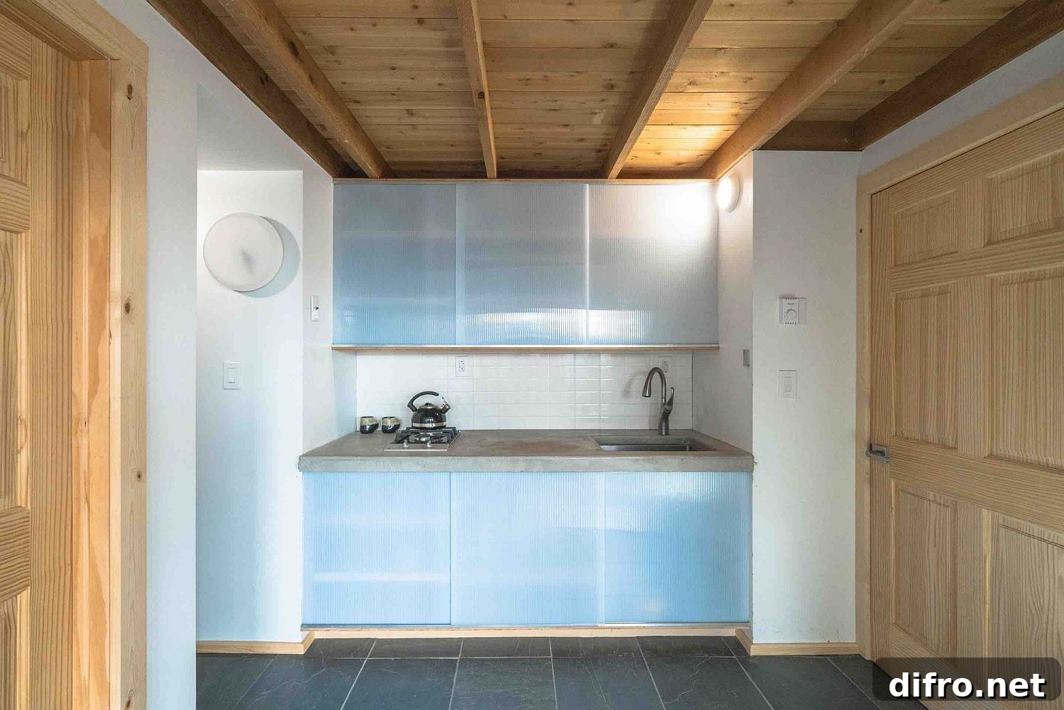 Minimal kitchen with frosted glass cabinet doors