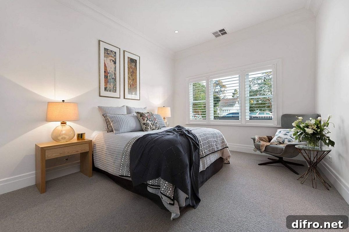 Bedroom with symmetrical bedside tables and lamps