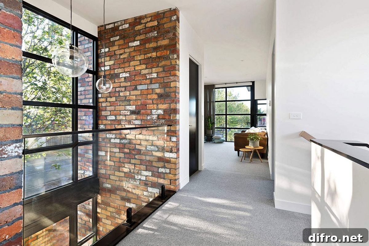 Stairwell framed by exposed brick wall