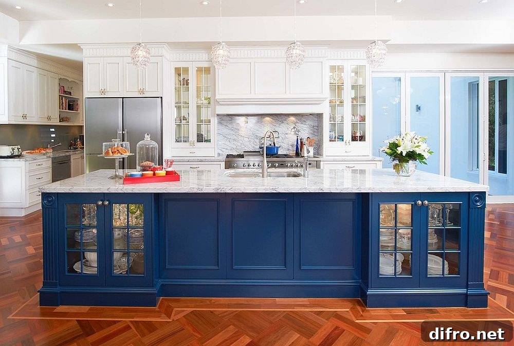 Blue kitchen island with white marble top
