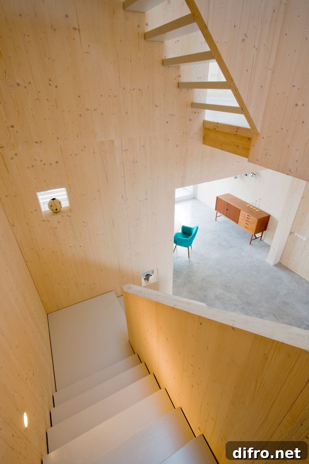 Clean, aesthetic impact of pinewood on the interior of this five-storey townhouse.