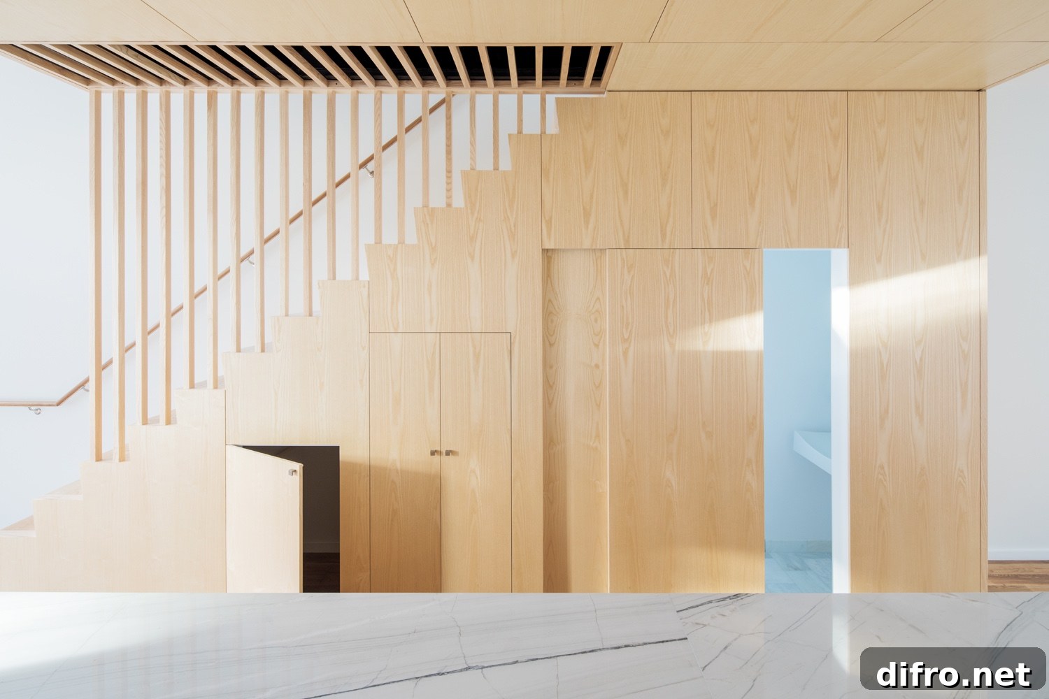 Pinewood stairs and cabinetry at the Wayne Street Row House.