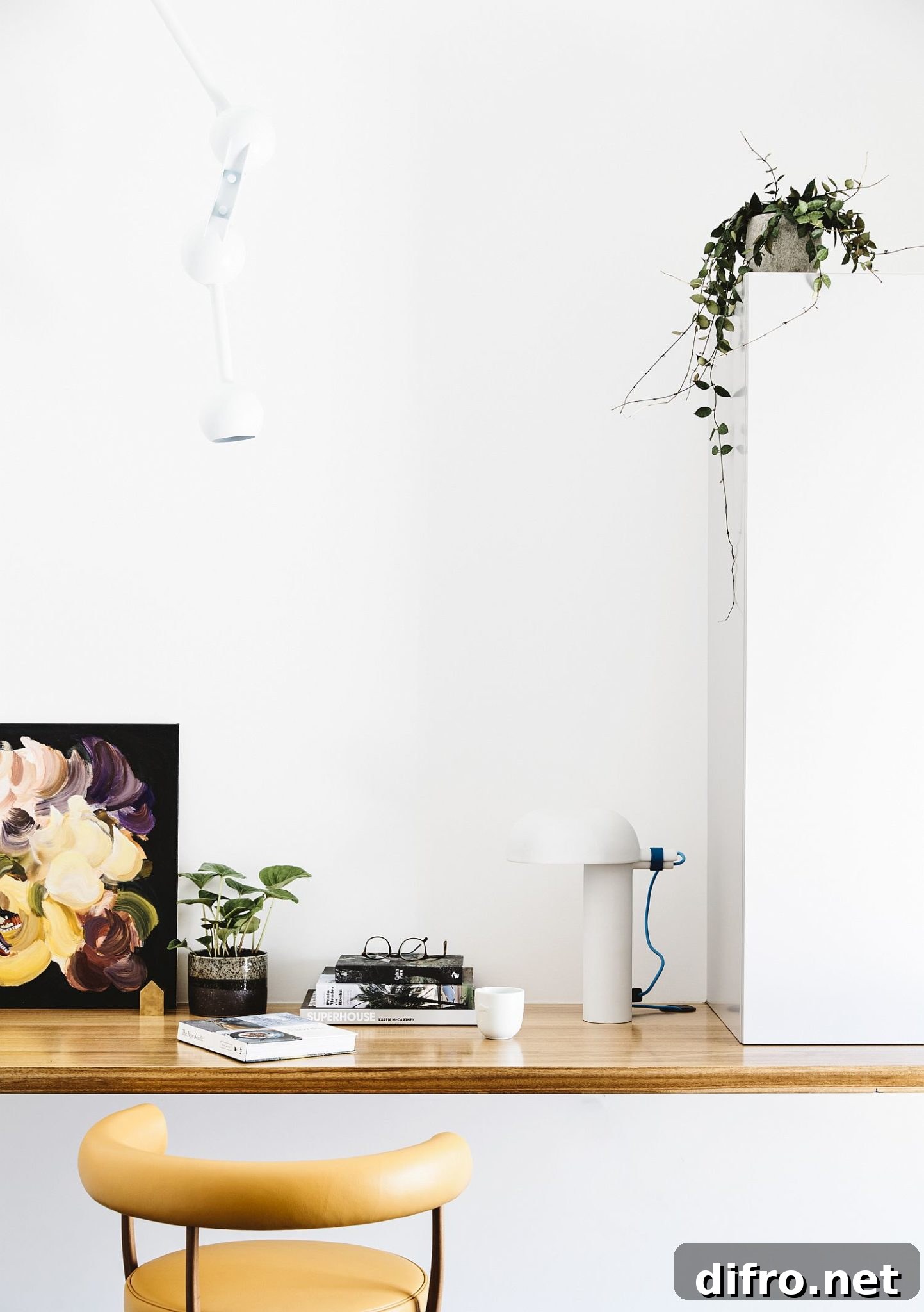 Minimal white walls and wooden plank workspace