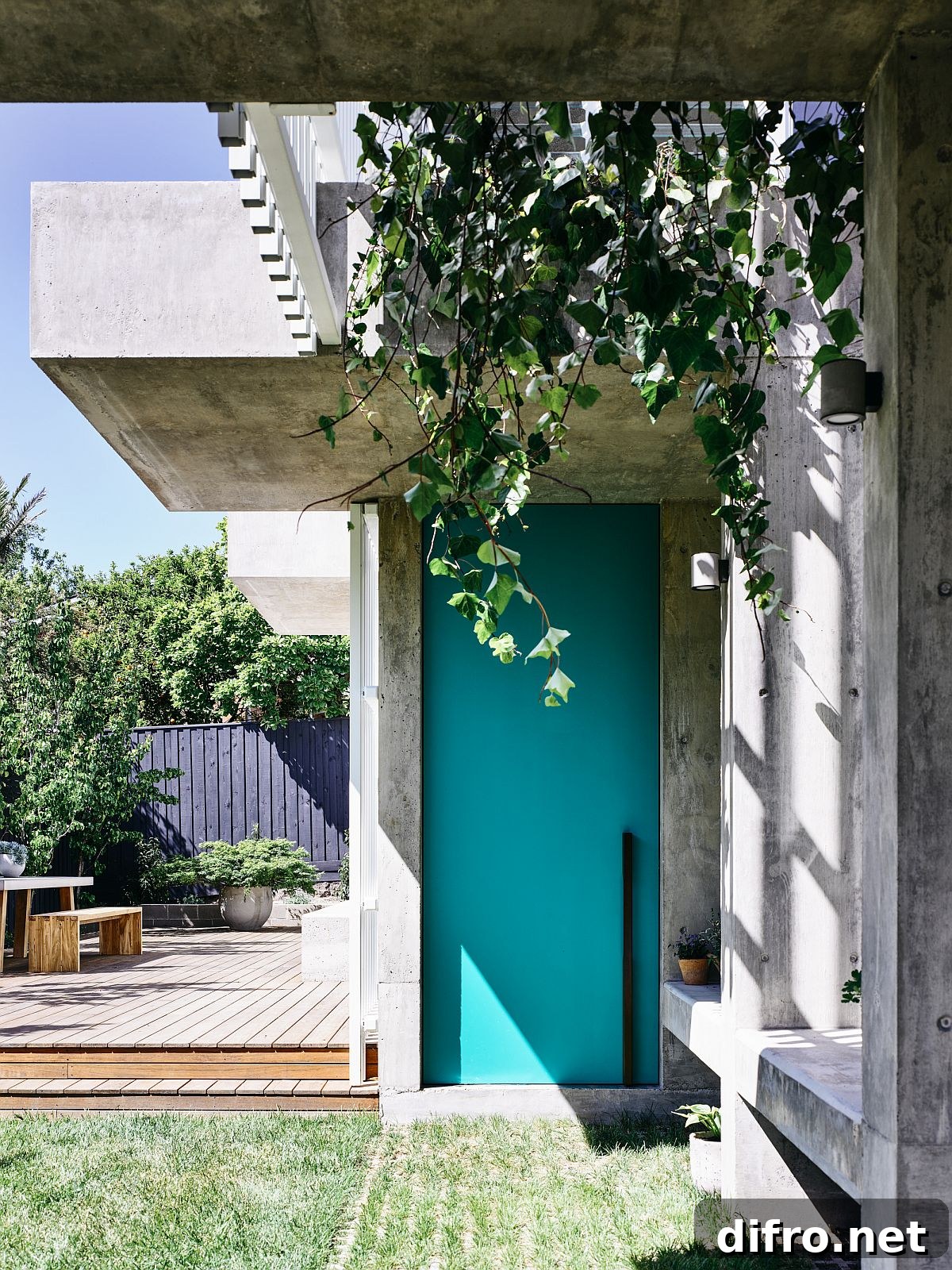Hanging plants and grasscrete at the house entry