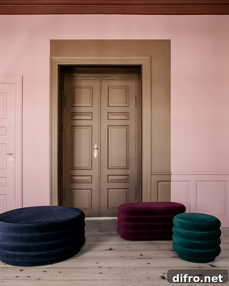 A blush background meets jewel-toned furniture