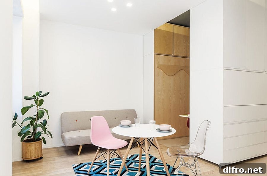 White micro-apartment with a pop of color