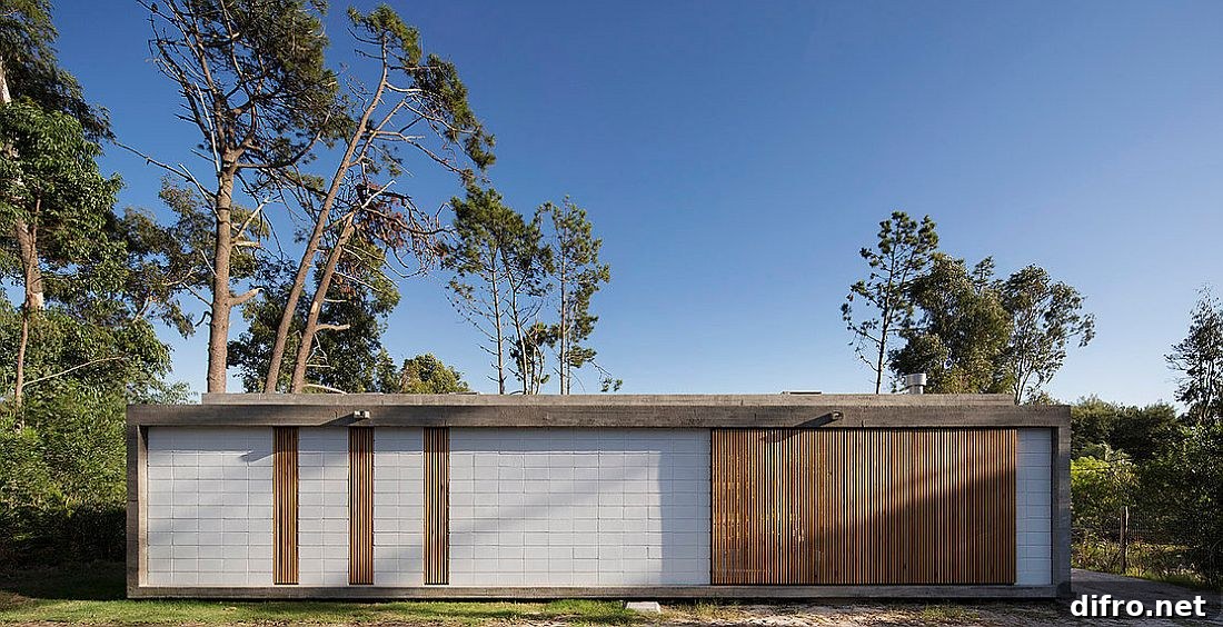 Rear facade of the house to the south is largely closed from the outdoors