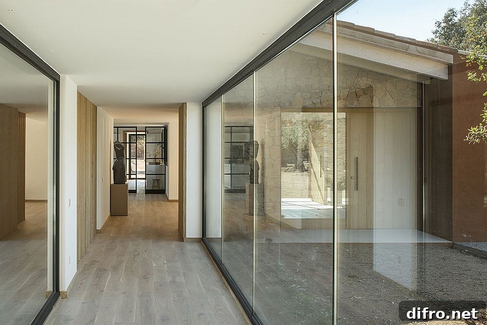 Floor-to-ceiling glass walls with outdoor views