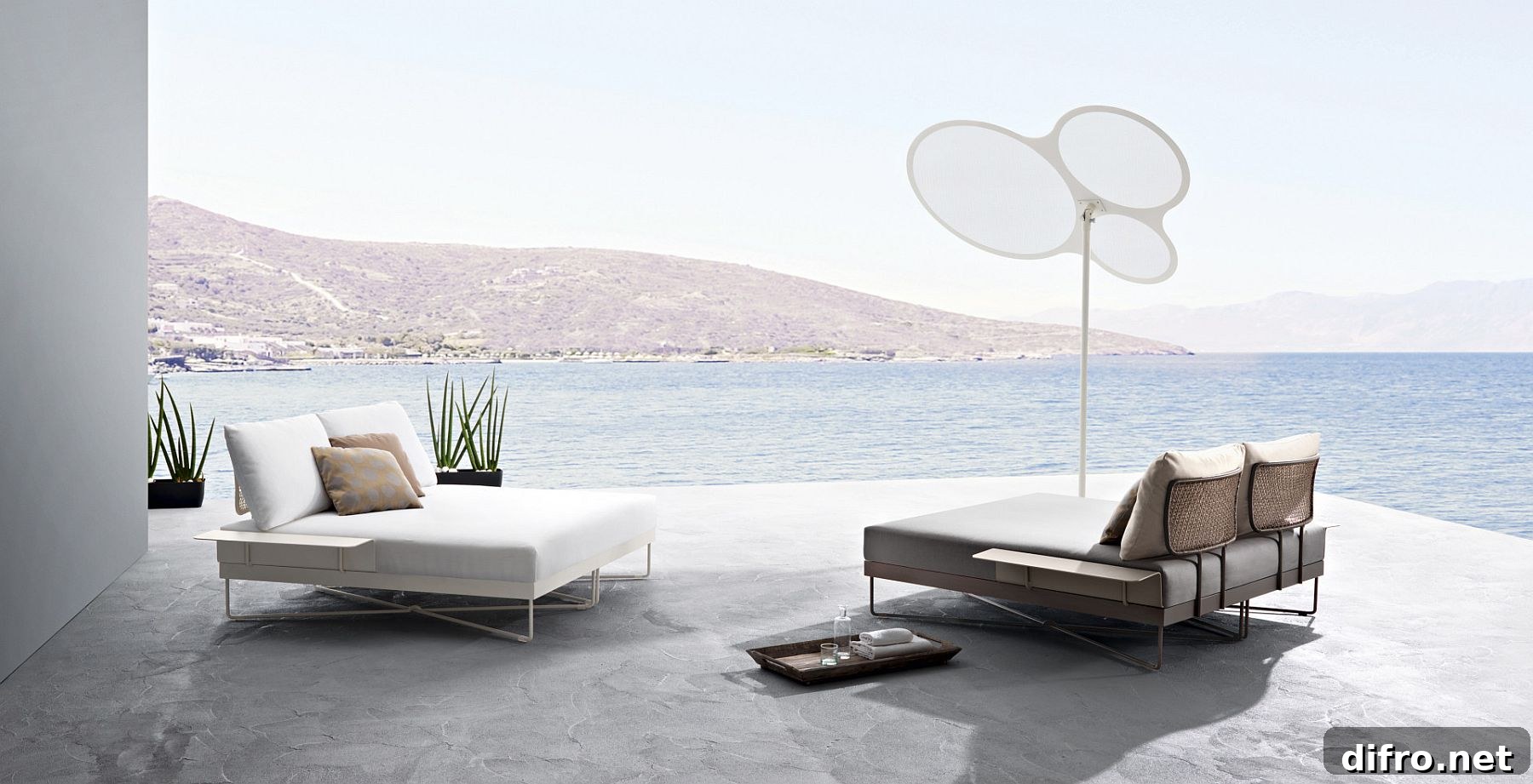 Minimal aluminum frames and comfy cushions create a series of outdoor sofas and loungers