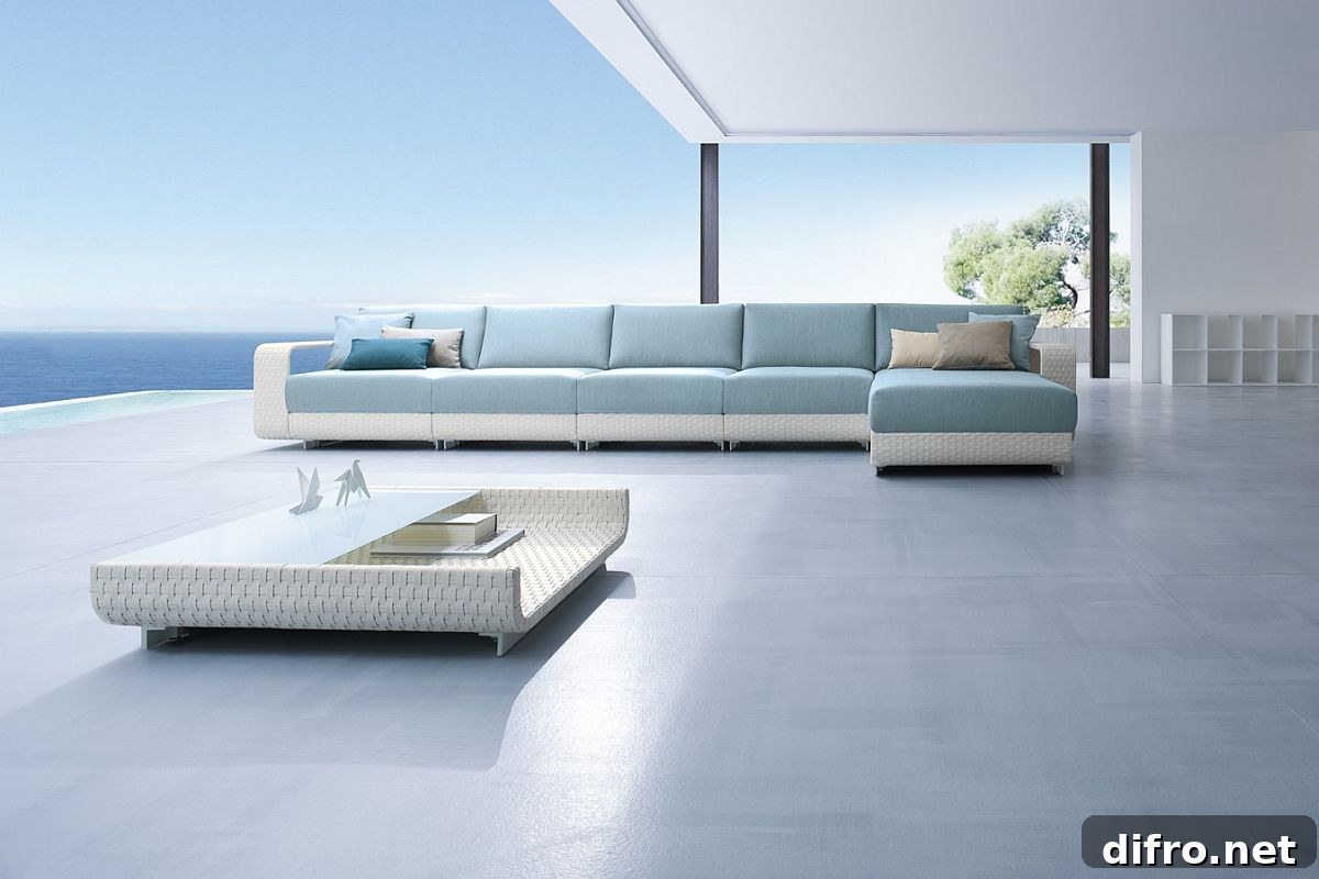 Outdoor sofa in light blue with a low-slung coffee table
