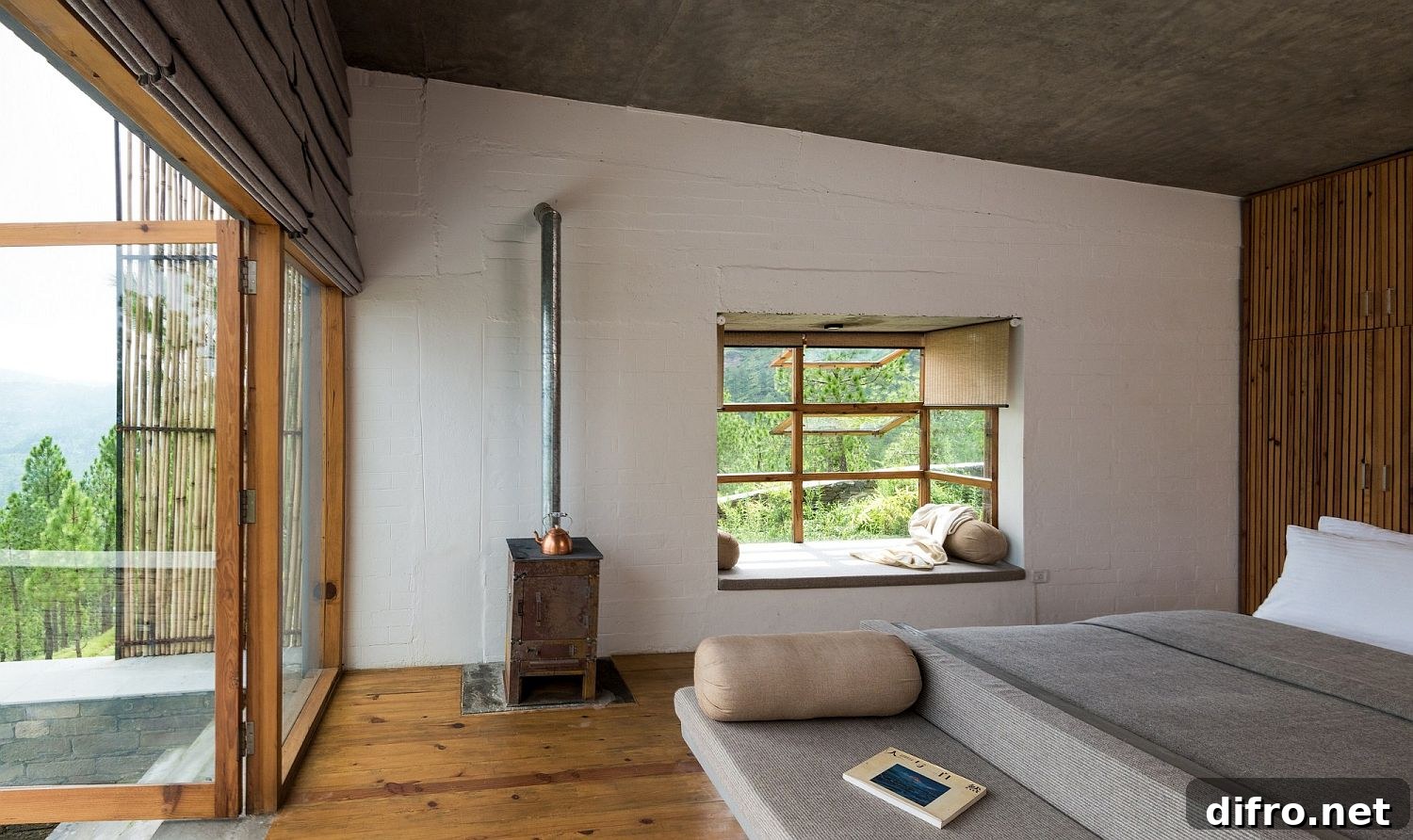 Cozy bedroom with wood finishes and bamboo at The Kumaon