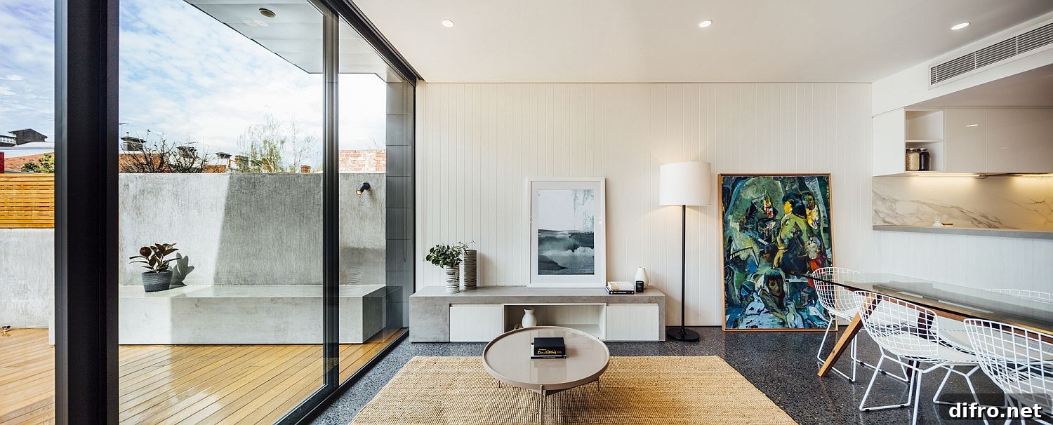 Light-filled lower level dining connected to the wooden deck outside