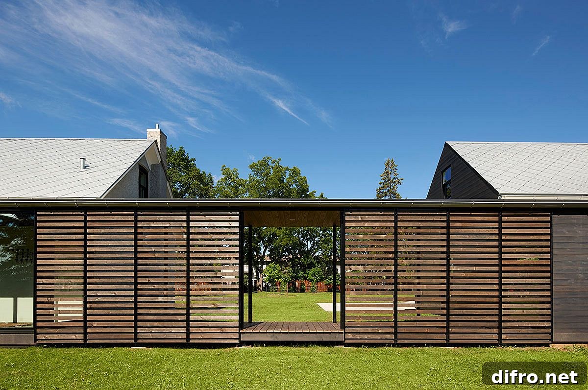Covered walkway connects the two units of the Foster Road Retreat