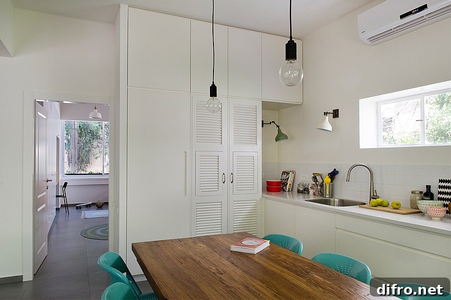 Combining the dining area with the single wall kitchen saves plenty of space