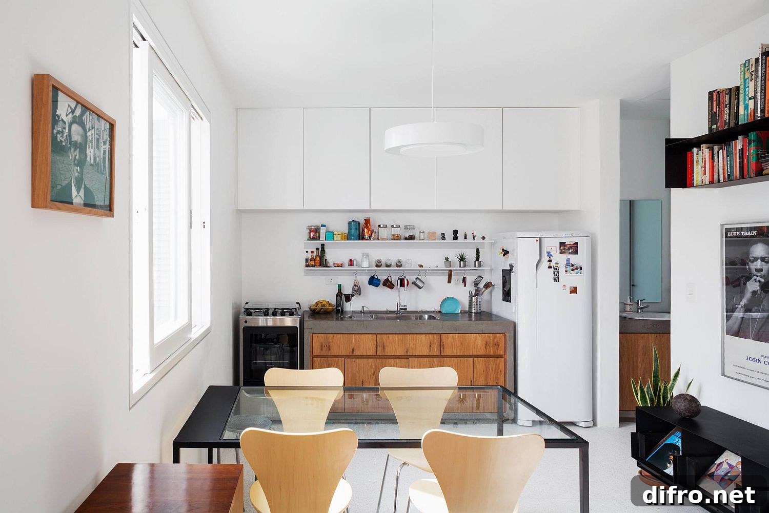 Fabulous modern kitchen at the end of the open plan living inside the Brazilian apartment