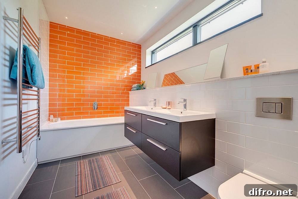 Orange accent wall in modern bathroom