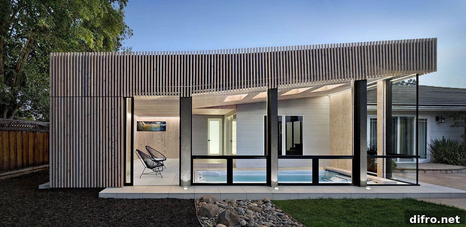 Glass walls bring ample natural light into the pool house