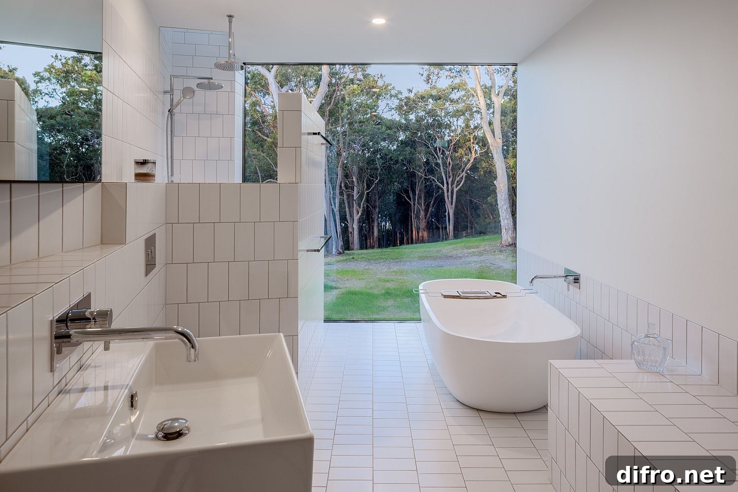 All-white bathroom connected to the garden