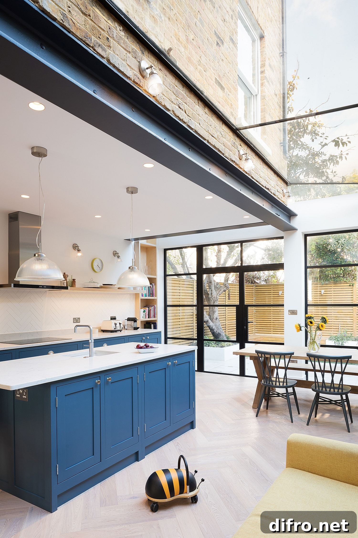 Exposed brick wall coupled with steel and glass for the modern home