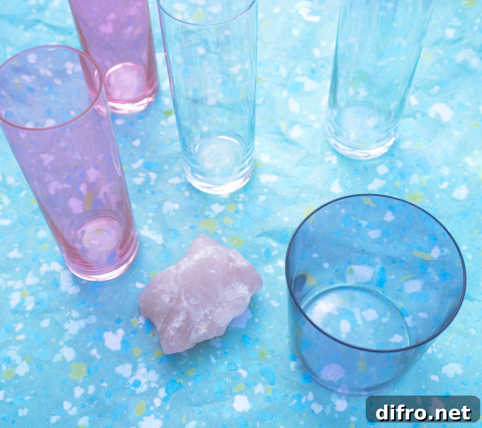 Iridescent champagne flutes and pink glasses