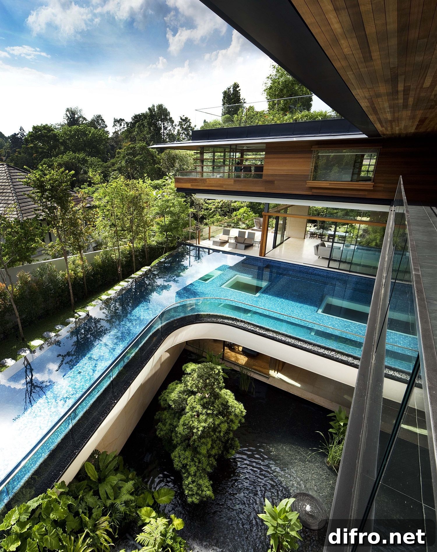 Curved swimming pool on the upper level