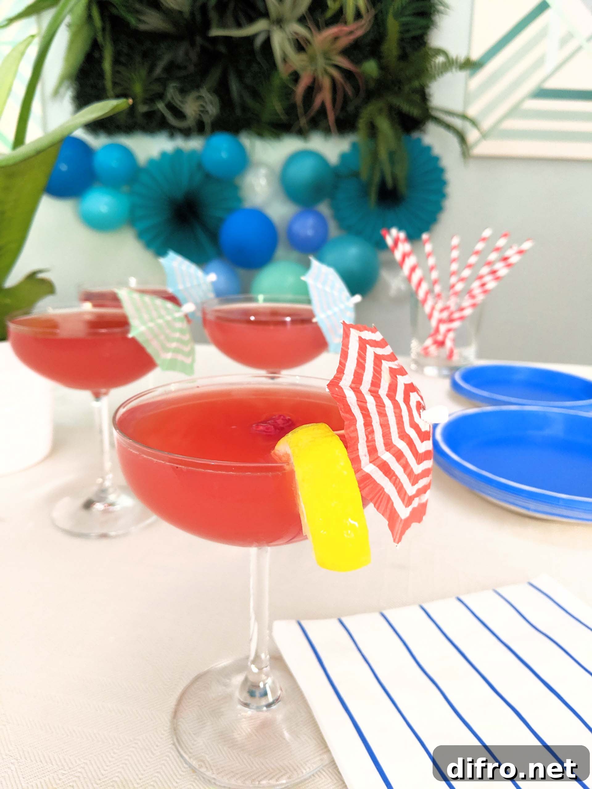 Decorated party table with striped umbrellas