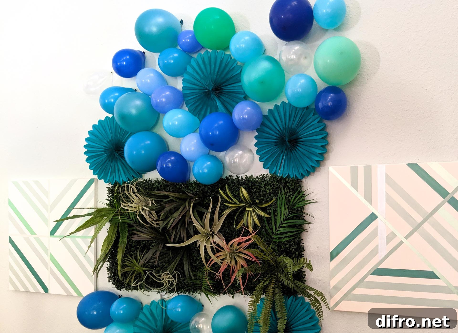 Balloon and paper fan party wall backdrop