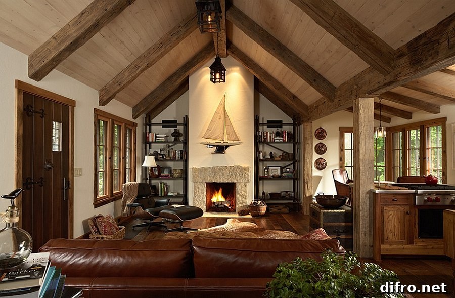 Living room with high ceilings, featuring wooden ceiling beams and a fireplace.
