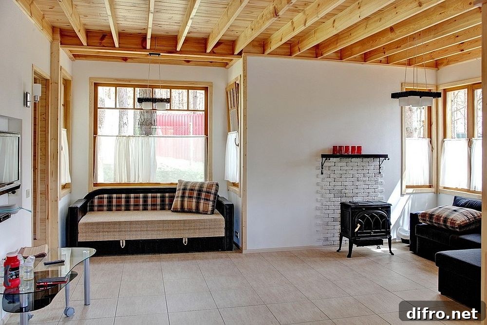 Cabin-style living room with small wooden ceiling beams.