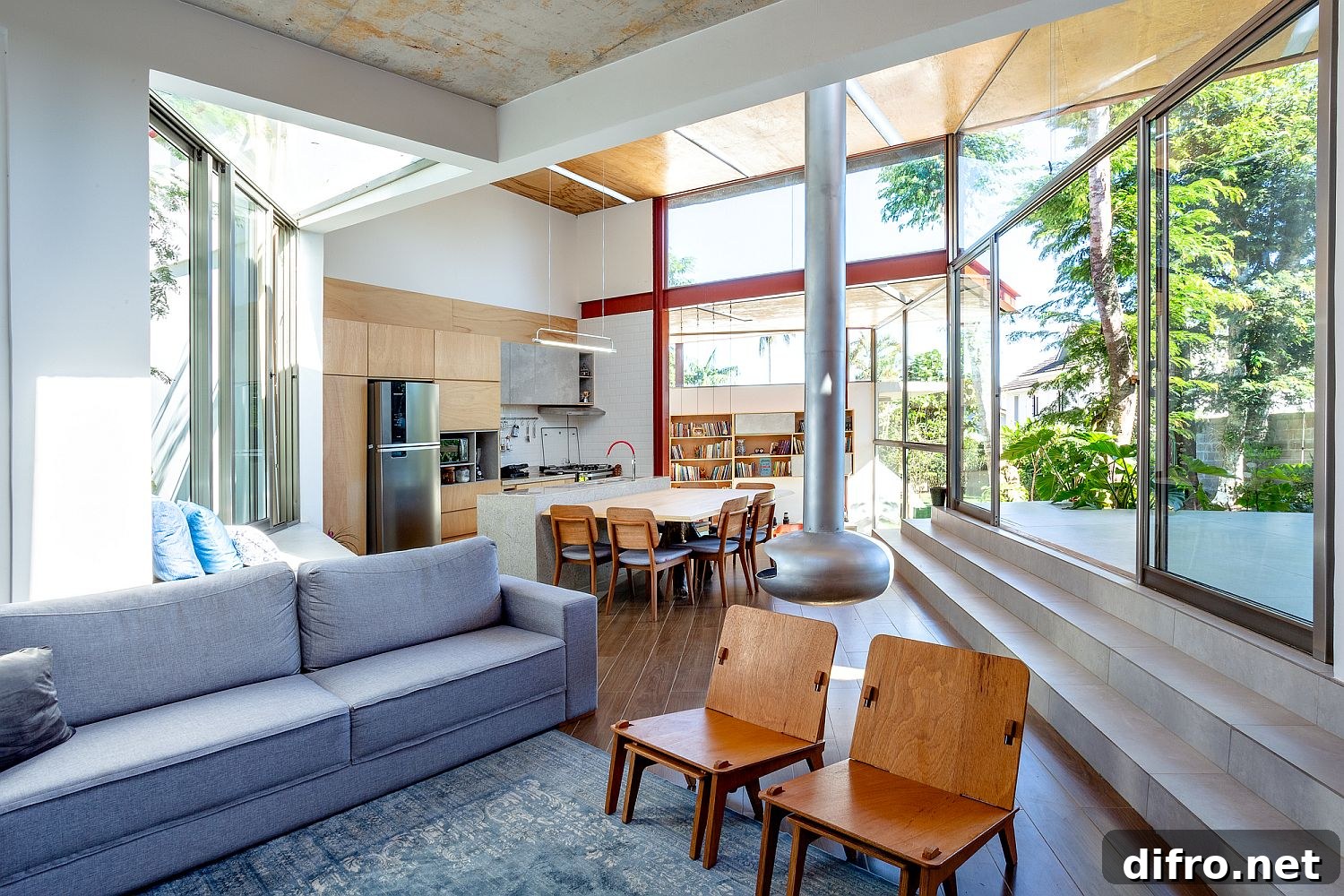 Open dining area, kitchen and living room of the House Between Trees