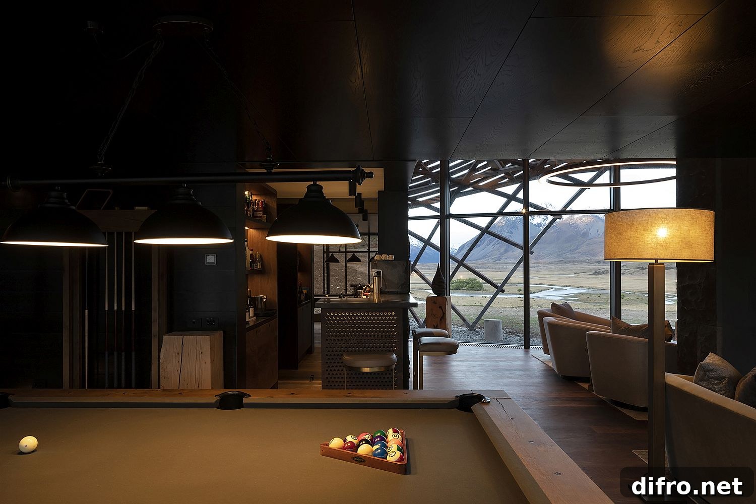 Interior with pool table, bar and living area