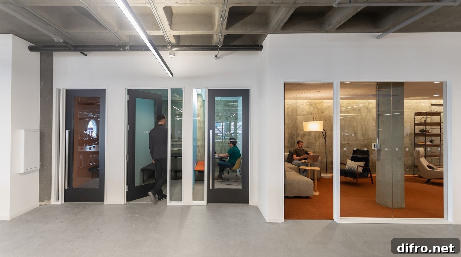 Glass walls connecting private workspaces with larger work zones