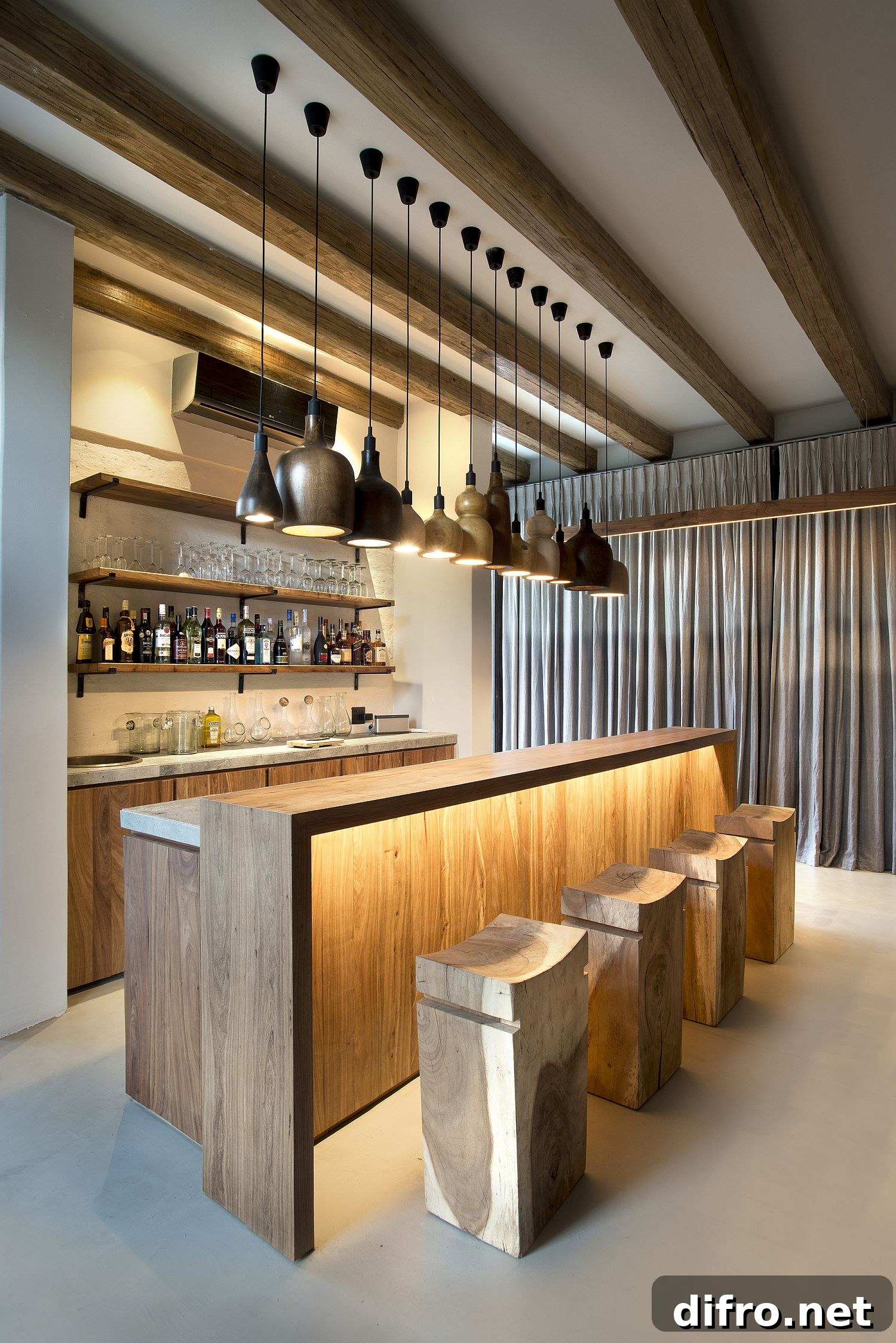 Diverse pendant lighting above the home bar