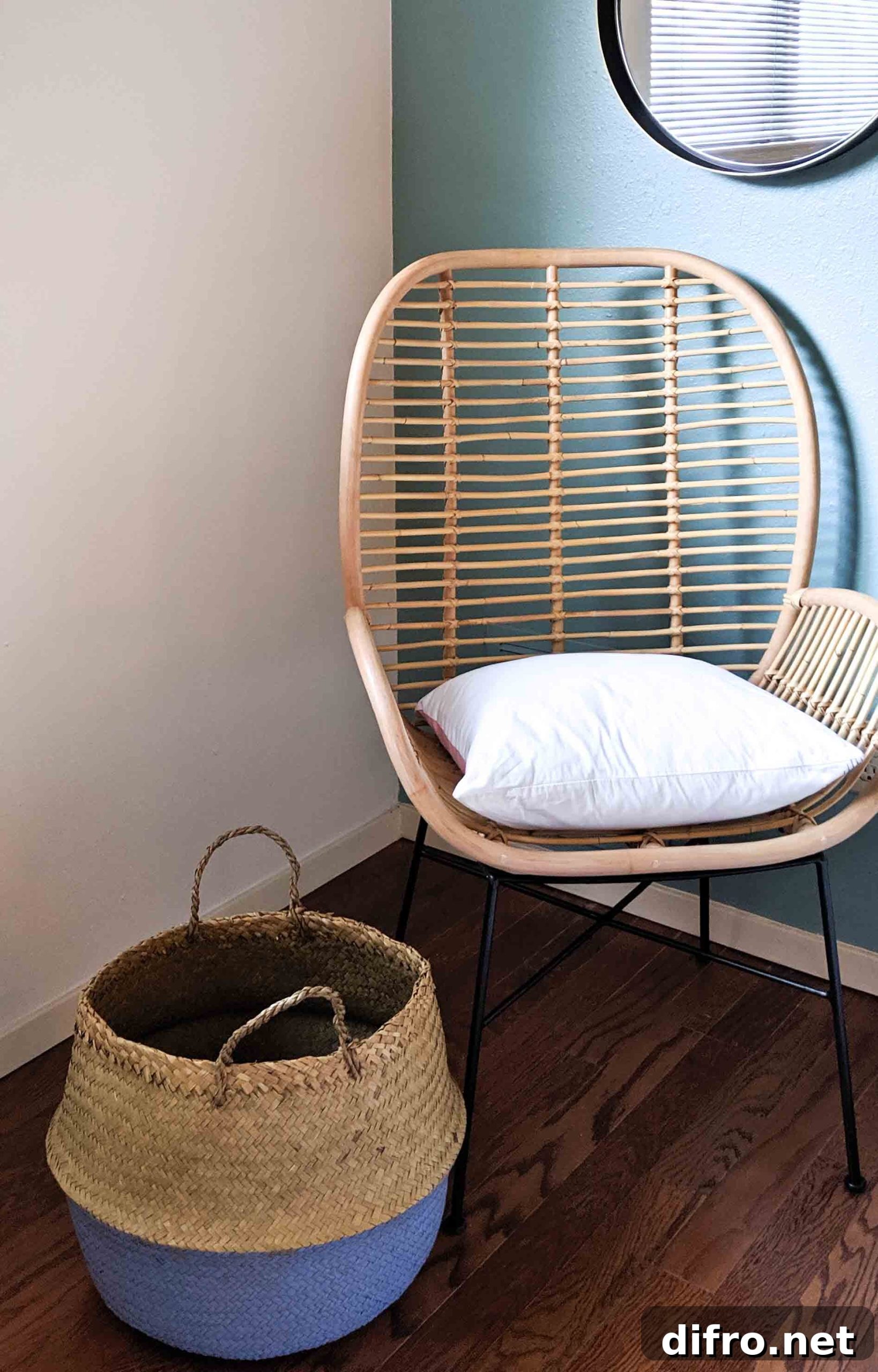 Earthy two-tone belly basket beside a rattan chair