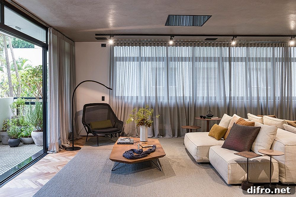 Open living area of the concrete apartment in Sao Paulo