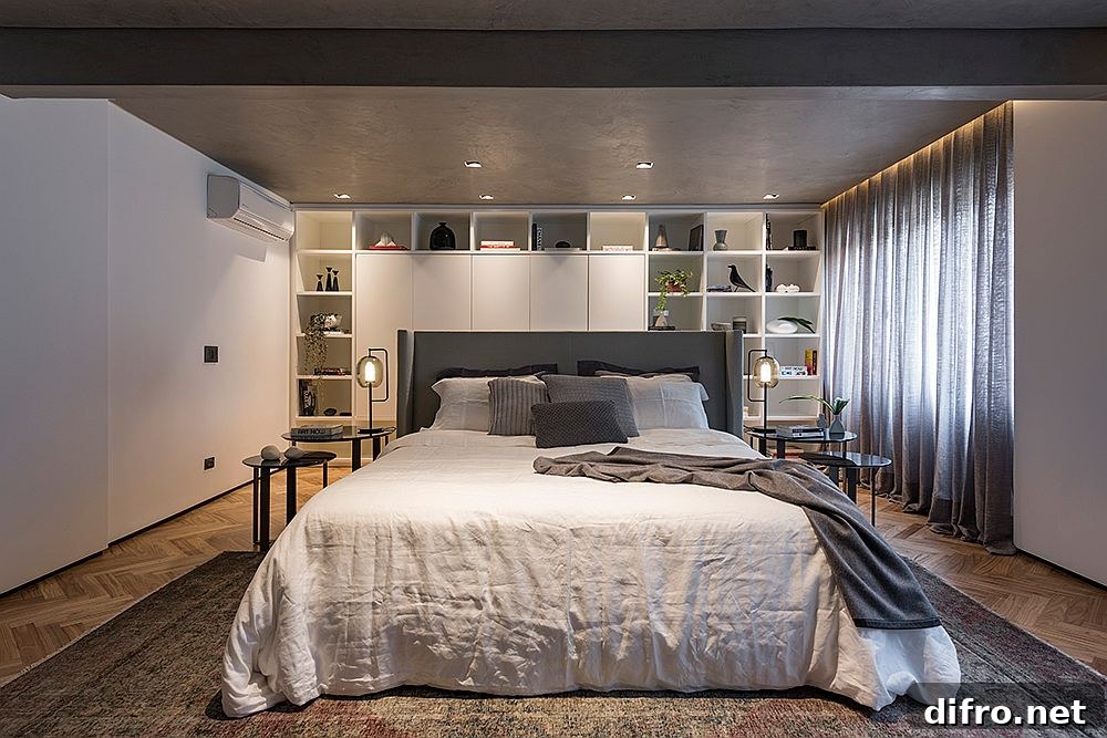 Walls of the bedroom provide ample storage and display space