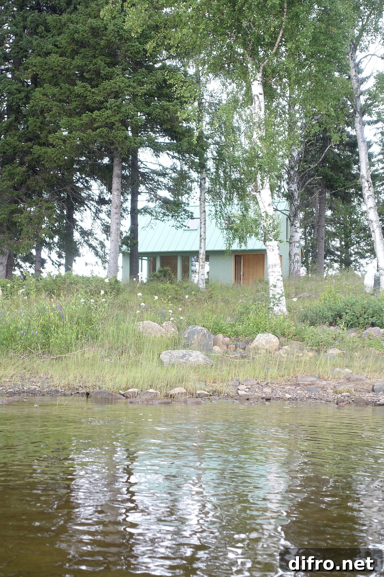 Light green cabin in the forest