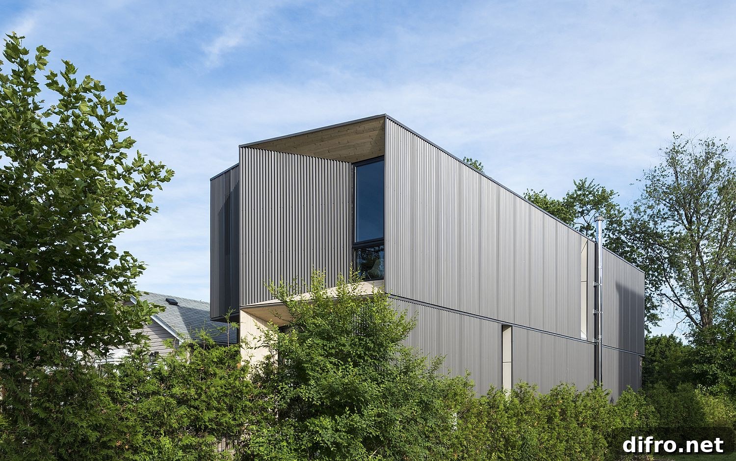 Contemporary exterior of the Tesseract home in gray
