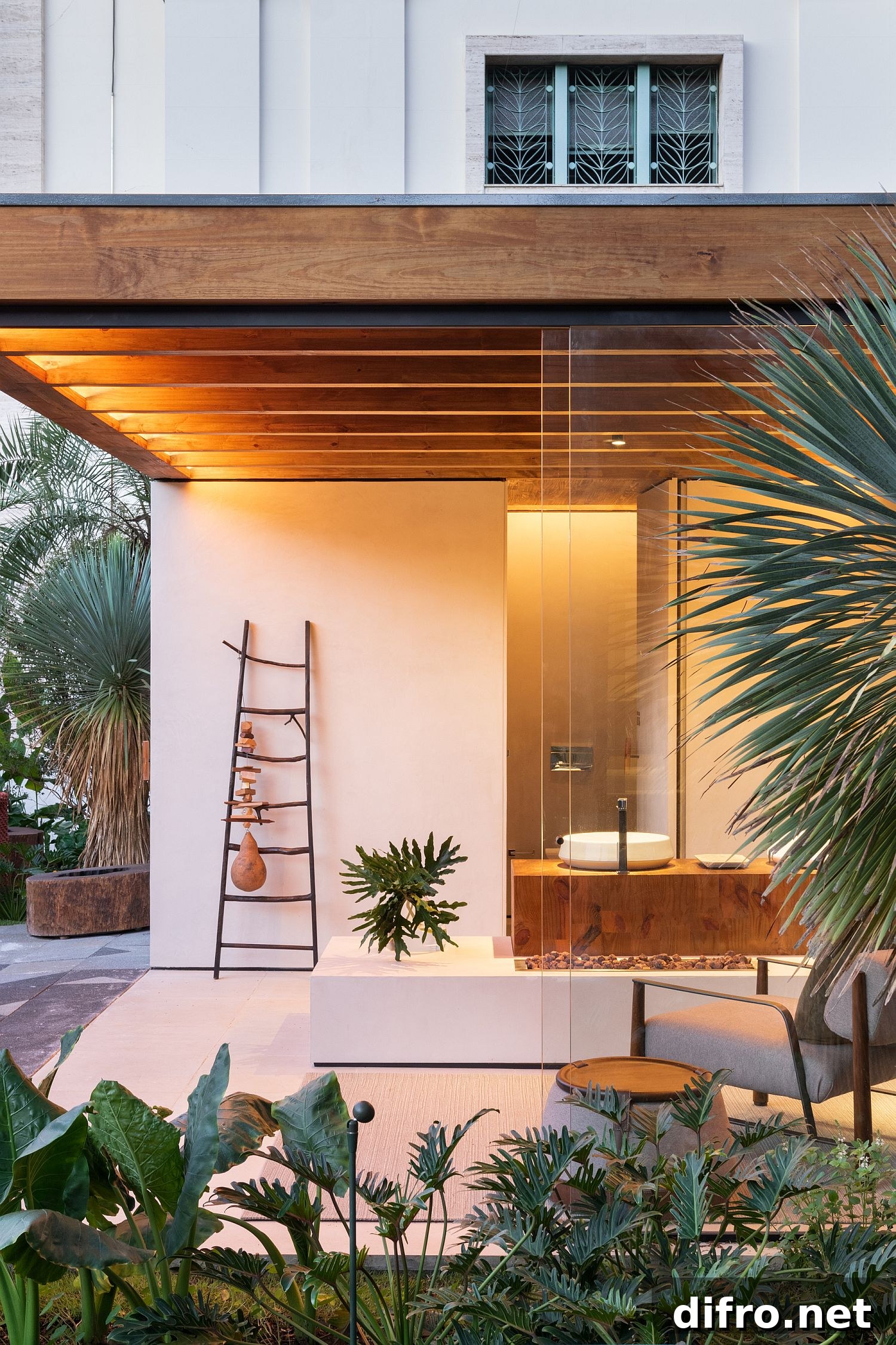 Pergola-like structure of the terrace extends the living area into the garden