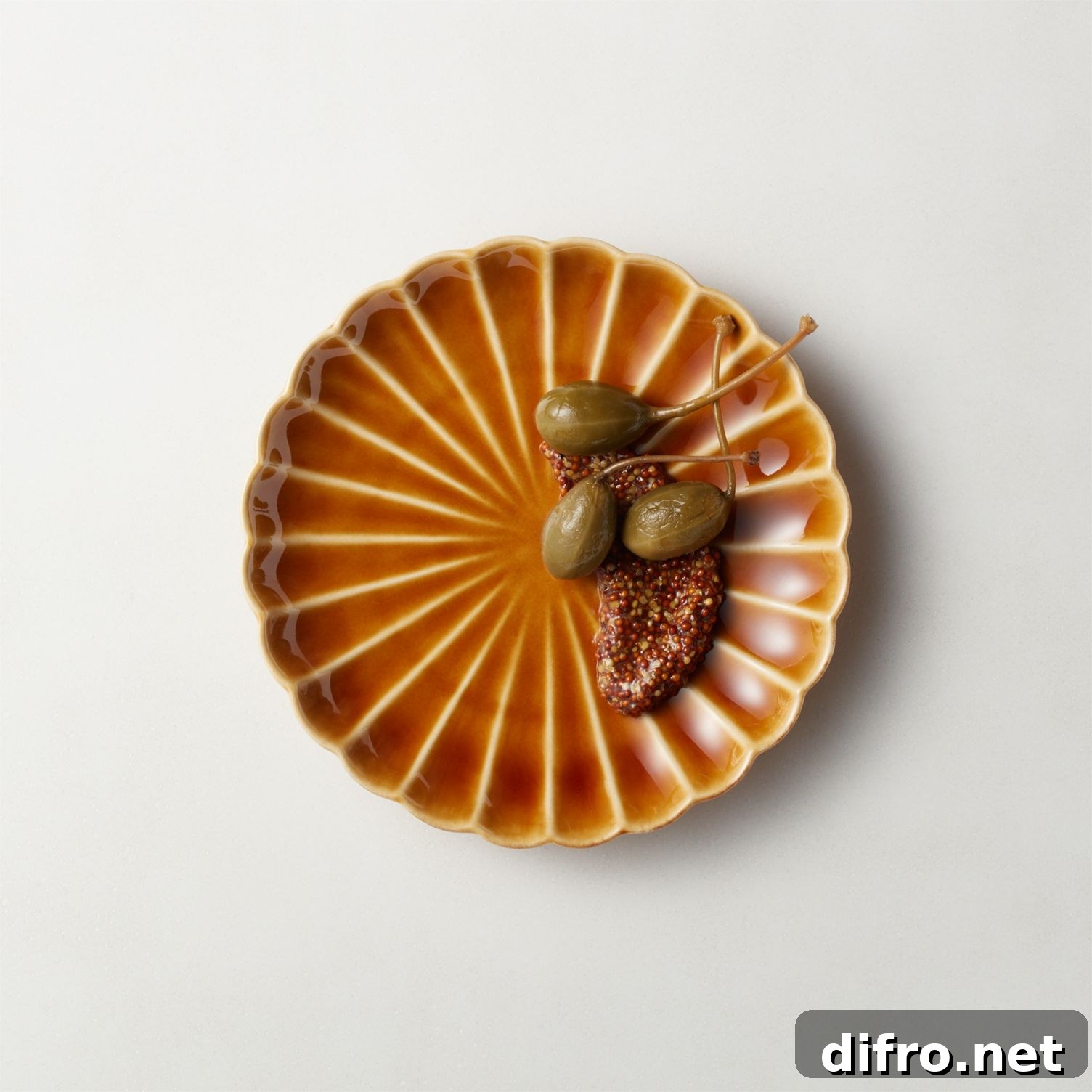 Scalloped ceramic appetizer plate in camel
