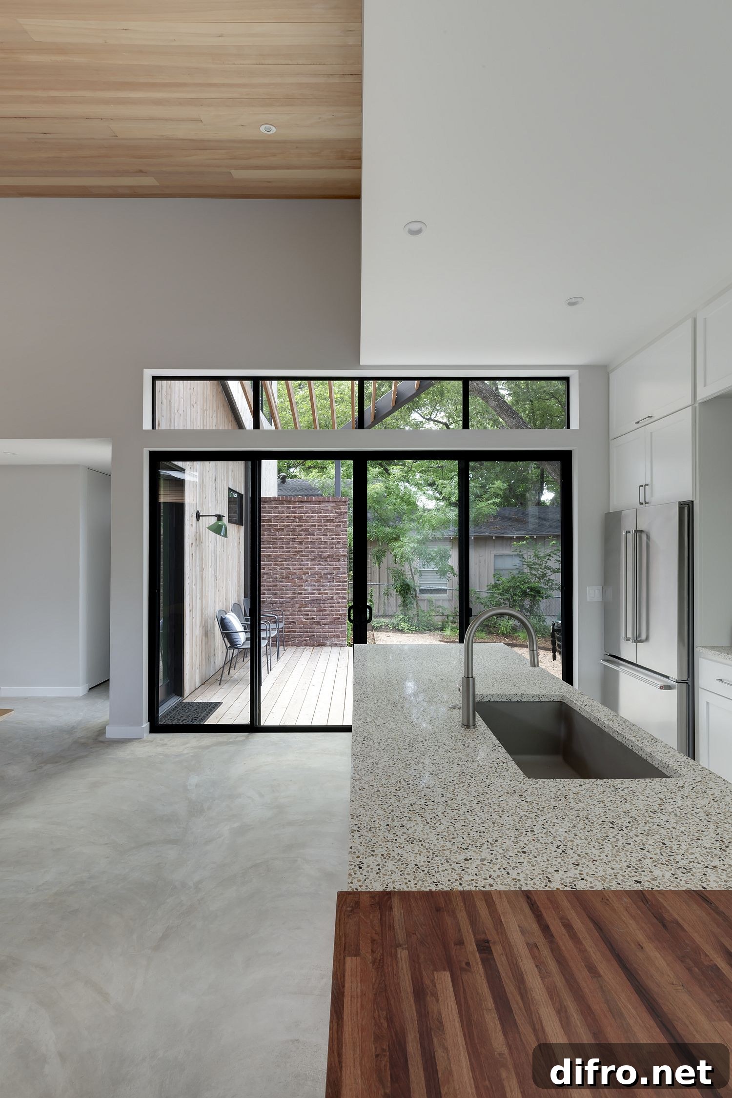 Kitchen inside the house connected with the greenery outside
