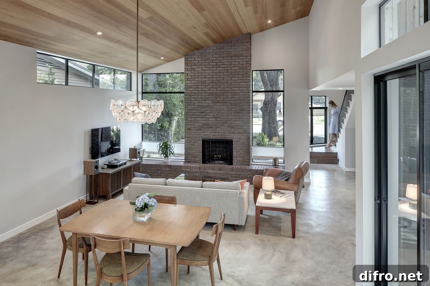 Open plan living area with fireplace at its heart