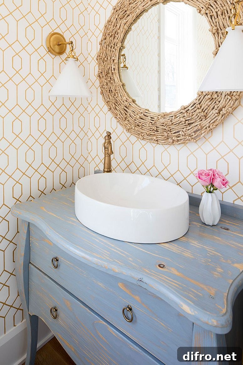 Distressed coastal decor in small powder room